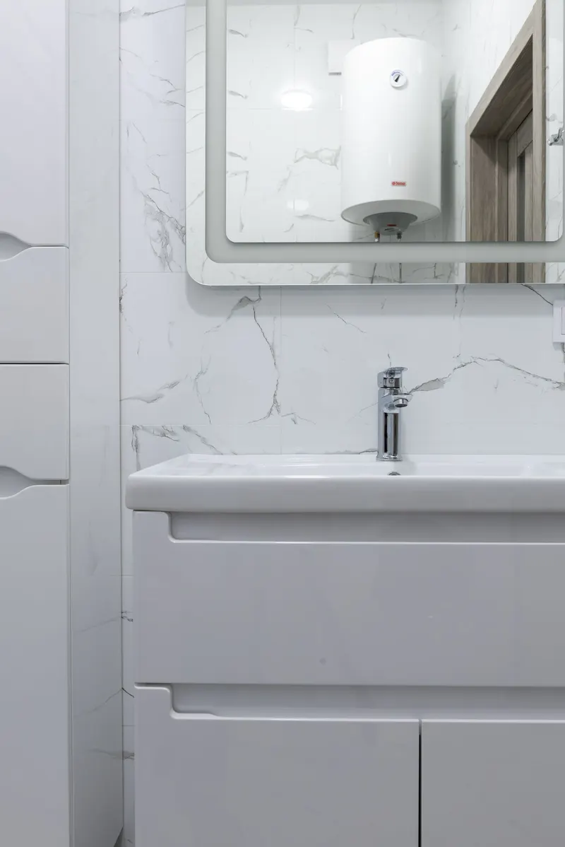 Modern white bathroom vanity with new faucet
